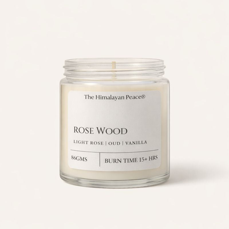 Rose, oud and vanilla scented candle creating a warm and luxurious atmosphere