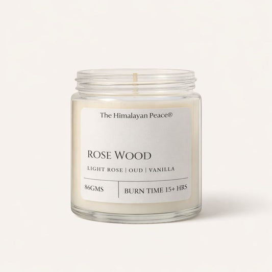 Rose, oud and vanilla scented candle creating a warm and luxurious atmosphere